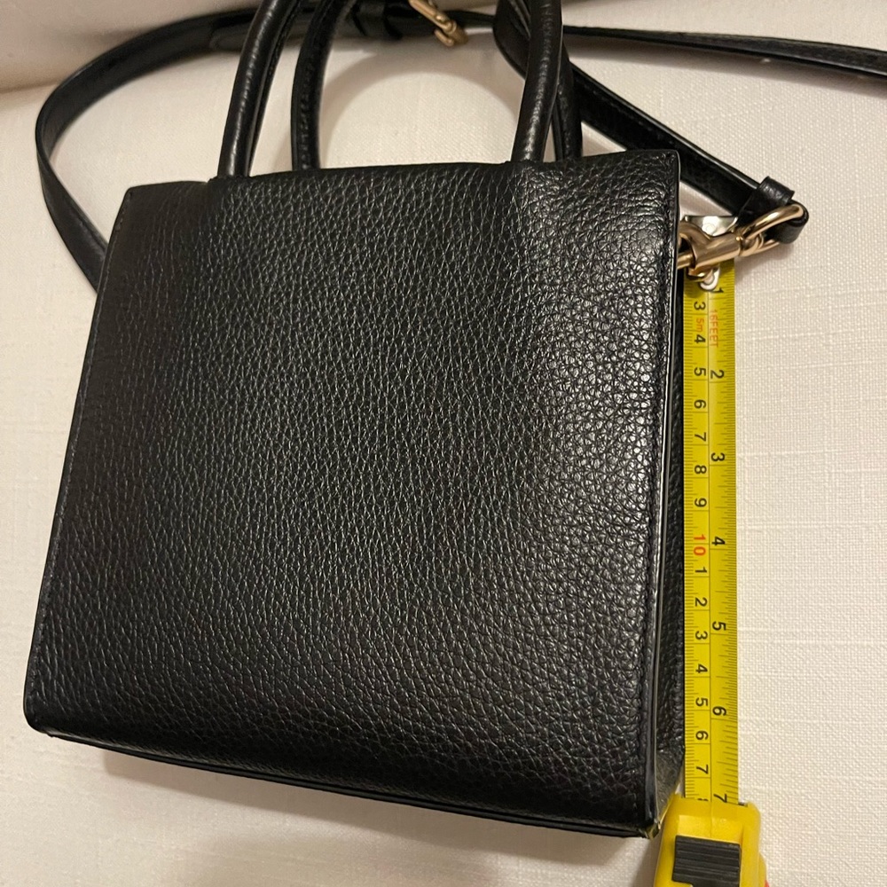 Super cute mini Black coach bag. Like new! Yellow hanckey not included.
